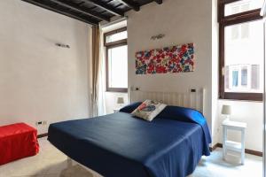 Кровать или кровати в номере Urbana Colosseo Boutique Apartment