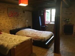 a bedroom with a bed and a window at chambre privée in Lombron +34 photos