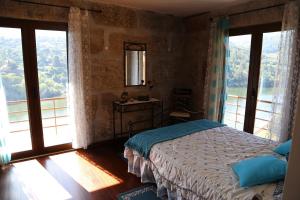 En eller flere senge i et værelse på Casa Vista Alegre