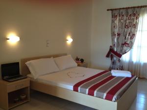 A bed or beds in a room at Antonio Studios