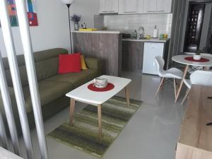 a living room with a couch and a table at Apartman Nina in Bar
