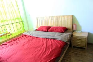 Cama ou camas em um quarto em Dalan Youth Hostel