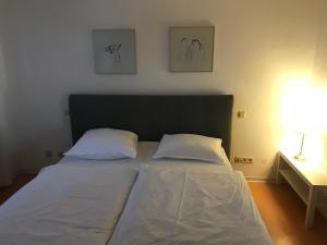 Ein Bett oder Betten in einem Zimmer der Unterkunft Apartment Roxheim