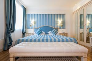 Posteľ alebo postele v izbe v ubytovaní Hotel Italia Palace
