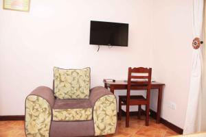 TV a/nebo společenská místnost v ubytování Hotel Marvin