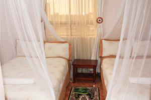 Postel nebo postele na pokoji v ubytování Hotel Marvin