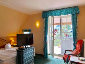 TV a/nebo společenská místnost v ubytování Hotel Residenz Rennhack