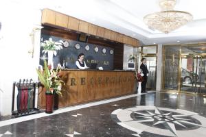 a lobby of a hotel with a reception desk at Puma Imperial Hotel in Ulaanbaatar +10 photos