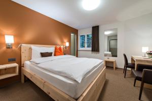 Łóżko lub łóżka w pokoju w obiekcie Hotel Donatz