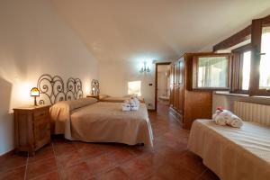 Postel nebo postele na pokoji v ubytování Azienda Agrituristica Le Terre Di San Leonardo