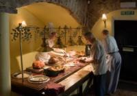 a group of people in a kitchen preparing food at Swan Hotel in Harleston