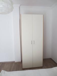 a closet with a white cabinet in a room at Studio Anna Veria Center in Veria