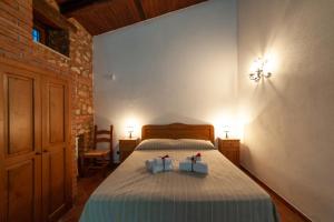 Postel nebo postele na pokoji v ubytování Azienda Agrituristica Le Terre Di San Leonardo