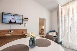 TV a/nebo společenská místnost v ubytování City Vibe Studios