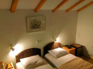 Postel nebo postele na pokoji v ubytování Hotel Ravnjak