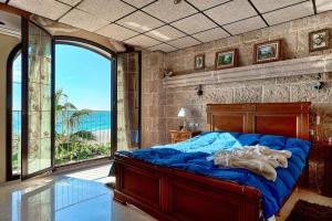 Ένα ή περισσότερα κρεβάτια σε δωμάτιο στο Casa de Sueño en la Playa