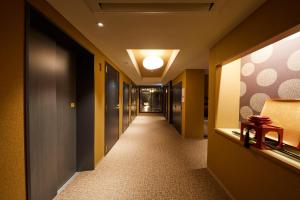 a hallway of a hotel room with a hallway at Rinn Gion Kenninji in Kyoto
