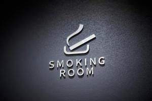 a logo for a smoking room with a smoking arrow at Rinn Gion Kenninji in Kyoto