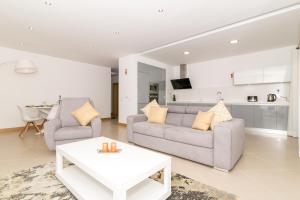 
a living room filled with furniture and a couch at Beach Condominium in Lagos
