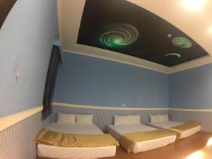 海王星會館特色民宿房間的床