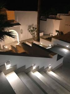 a set of stairs with lights on them at Dar Corniche La Marsa (Adults Only) in La Marsa
