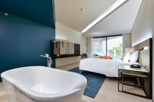 เตียงในห้องที่ Veranda Resort Pattaya - MGallery Collection