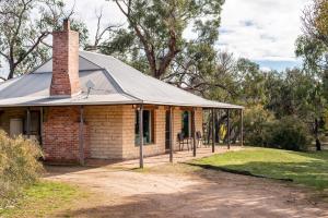 a brick house with a chimney on top of it at Grampians Pioneer Cottages in Halls Gap
