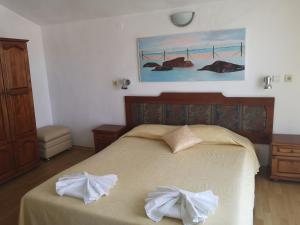 Postel nebo postele na pokoji v ubytování Family Hotel Verona