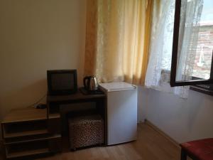 TV a/nebo společenská místnost v ubytování Family Hotel Verona
