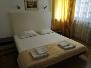 Postel nebo postele na pokoji v ubytování Family Hotel Verona