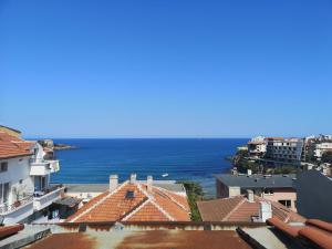 a view of the ocean from the roofs of buildings at Family Hotel Verona in Sozopol