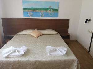 Postel nebo postele na pokoji v ubytování Family Hotel Verona