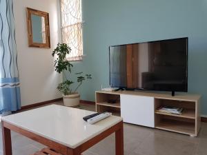 TV a/nebo společenská místnost v ubytování La Maison d'Isa
