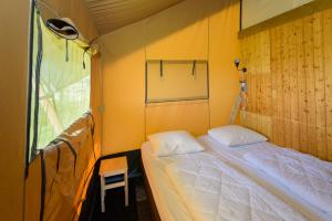 Een bed of bedden in een kamer bij Boerderij Halfweg
