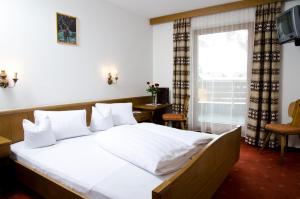 Posteľ alebo postele v izbe v ubytovaní Berghotel Rasis