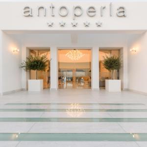 a store front of anrica with potted plants at Antoperla Luxury Hotel & Spa in Perissa