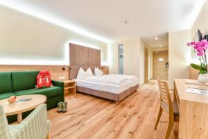 A bed or beds in a room at Hotel Regina