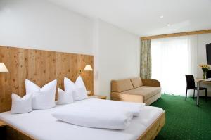 Posteľ alebo postele v izbe v ubytovaní Berghotel Rasis