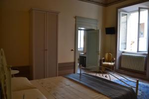 Postel nebo postele na pokoji v ubytování Palazzo Roberti + 27 fotografií