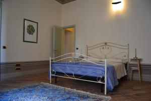 Llit o llits en una habitació de Palazzo Roberti