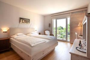 Postel nebo postele na pokoji v ubytování Hotel Hirschen in Freiburg-Lehen