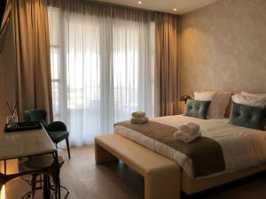 Postel nebo postele na pokoji v ubytování Hotel Acropolis " Op het sportiefste park van de kust "