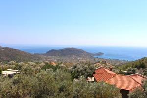 a view of the ocean from a house at Zephyros Hotel in Mesudiye