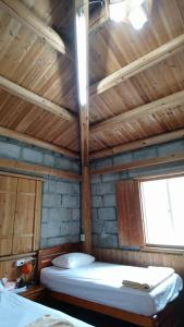 Postel nebo postele na pokoji v ubytování Jinsha Cultural Village