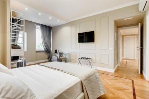 Μια τηλεόραση ή/και κέντρο ψυχαγωγίας στο Mellini Palace Suites by Premium Suites Collection