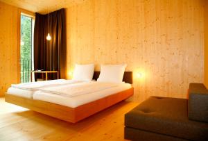 Postel nebo postele na pokoji v ubytování Alpenhotel Ammerwald