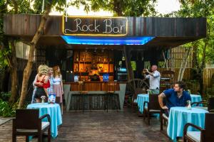 a restaurant with blue tables and a rock bar at King Rock Residence in Siem Reap +97 photos