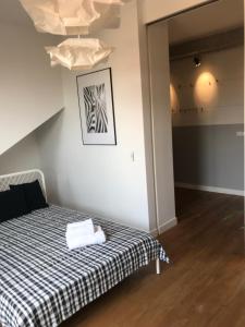 Posteľ alebo postele v izbe v ubytovaní Apartament "WARSZAWA"