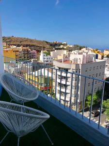 a balcony with a view of a city with buildings at Apartamento El Reloj 1 in Los Llanos de Aridane