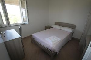 Appartamenti Torre tesisinde bir odada yatak veya yataklar